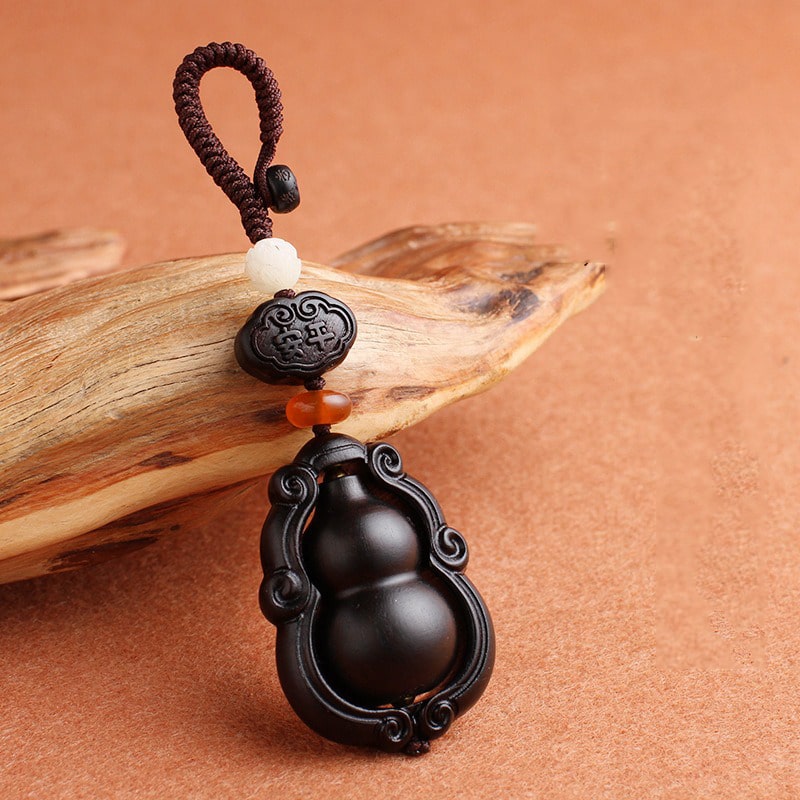 moc-khoa-phong-thuy-bau-ho-lo-bang-go