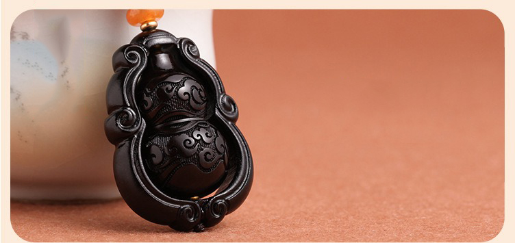 moc-khoa-phong-thuy-bau-ho-lo-bang-go