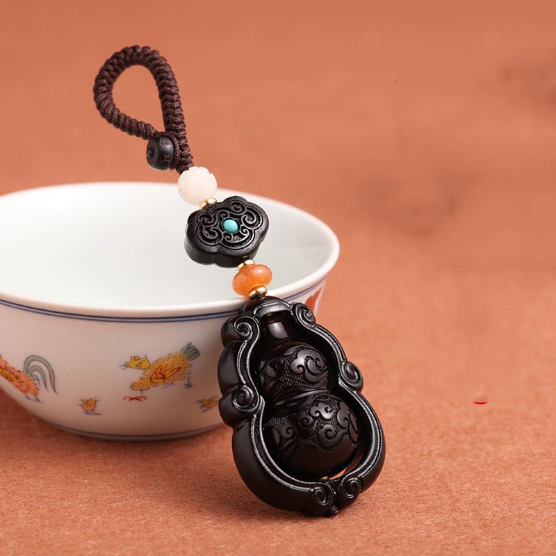 moc-khoa-phong-thuy-bau-ho-lo-bang-go