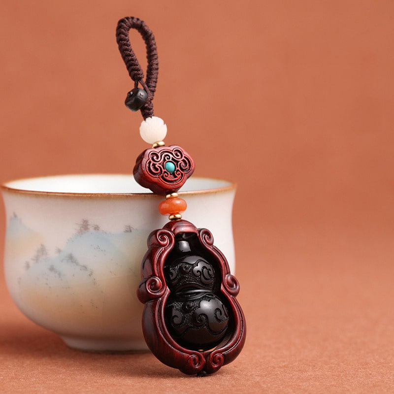 moc-khoa-phong-thuy-bau-ho-lo-bang-go