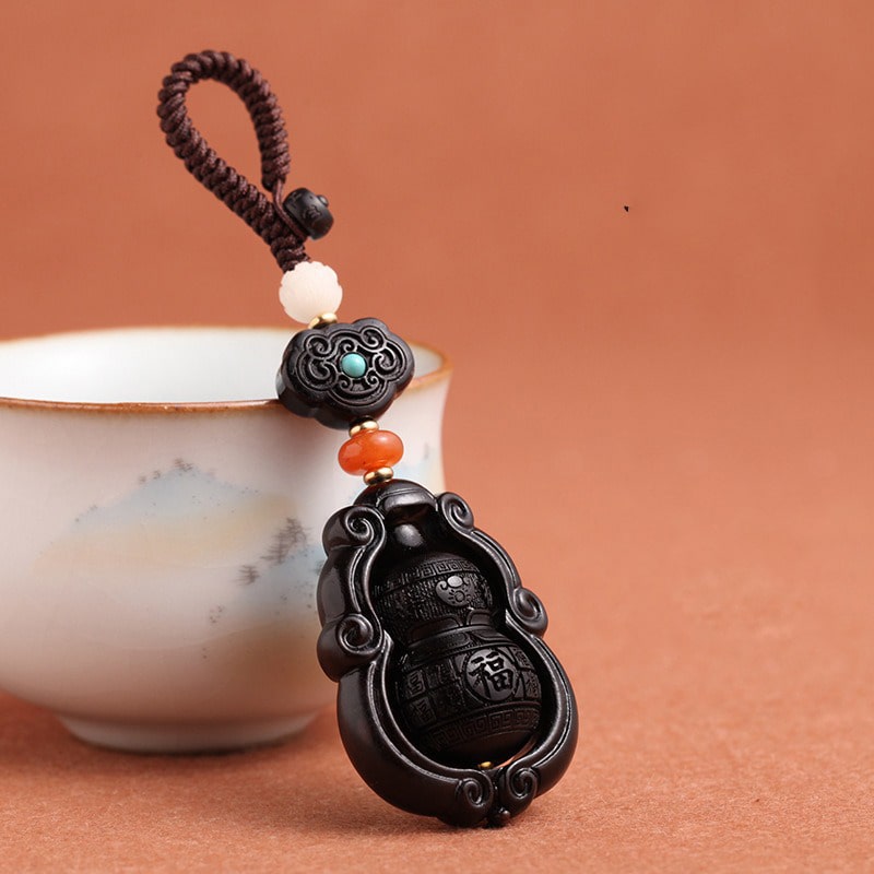 moc-khoa-phong-thuy-bau-ho-lo-bang-go