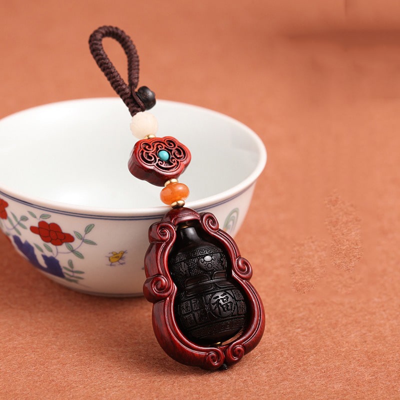 moc-khoa-phong-thuy-bau-ho-lo-bang-go